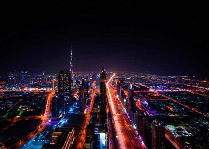 pexels-photo-219692-219692 A breathtaking aerial view of Dubai's cityscape at night, highlighting the illuminated Burj Khalifa and surrounding skyscrapers.